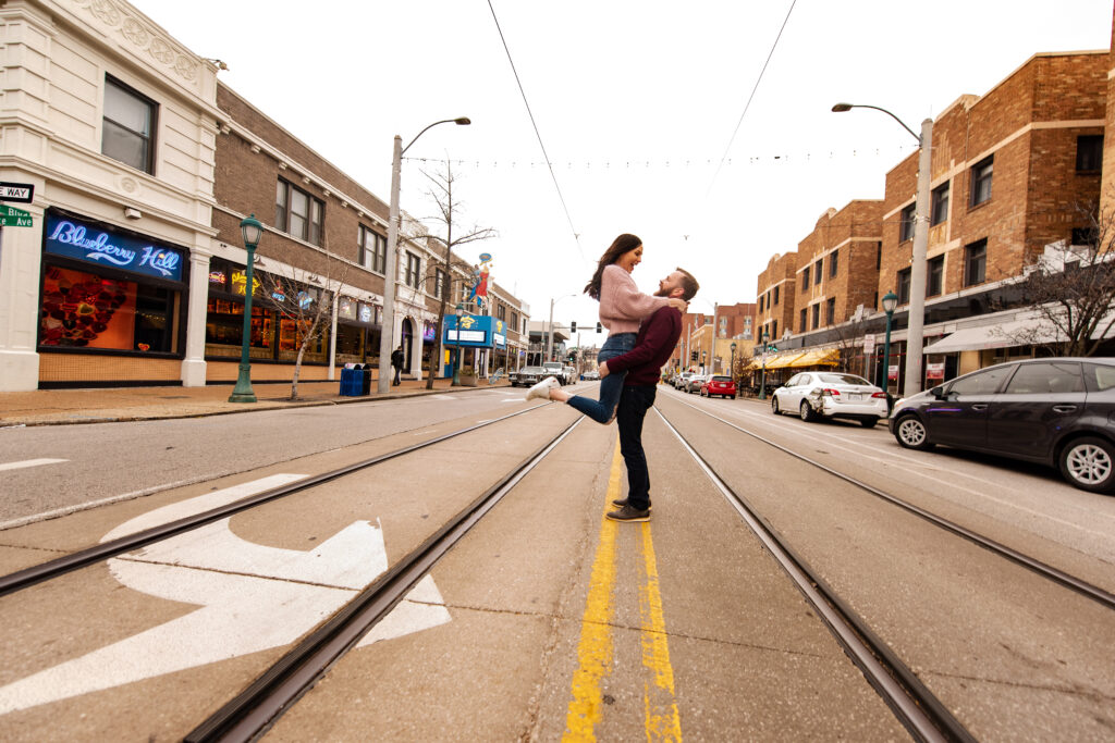 Rick pick up Sam in the Delmar Loop. Engagement photo

